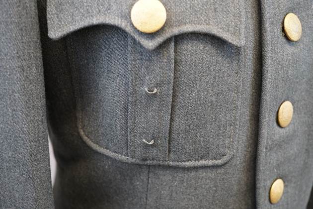 Close-up of a military uniform

Description automatically generated