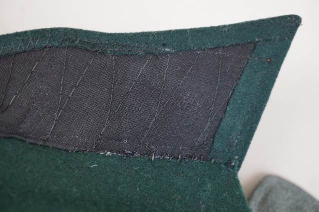 A patch on a green fabric

Description automatically generated