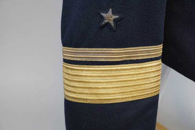 A close-up of a uniform

Description automatically generated