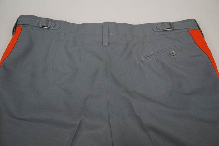 A close-up of a pair of grey pants

Description automatically generated