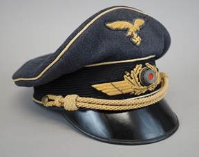 A black hat with gold and black patches

Description automatically generated with medium confidence