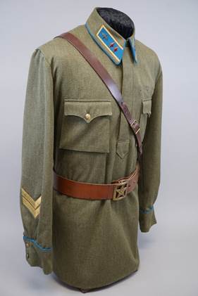 A uniform with a belt and a belt

Description automatically generated
